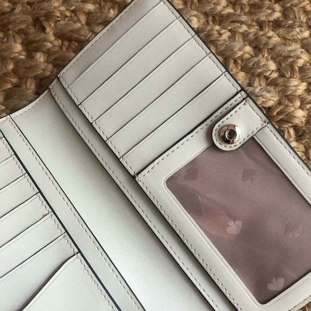 NWOT: Kate Spade Staci Slim Bifold Wallet. Saffiano Leather. Color is Parchment.